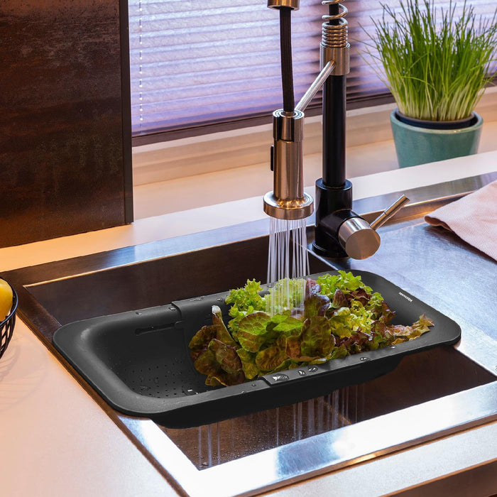 Westmark Abtropfsieb für Spülbecken  Ausziehbares Sieb zum Abtropfen von Obst, Gemüse & Geschirr  Praktische Abtropfschale  Schwarz, 36-49 cm